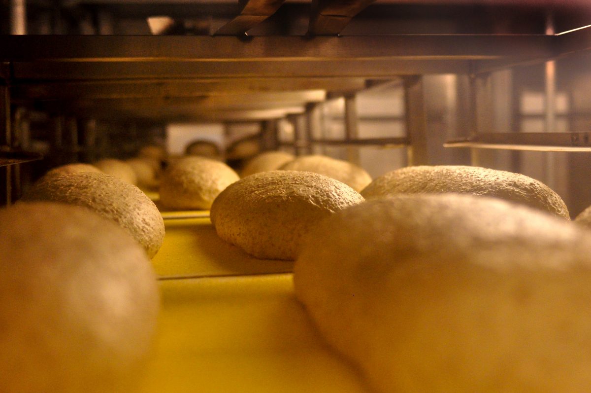 bread rolls on racks in packing department